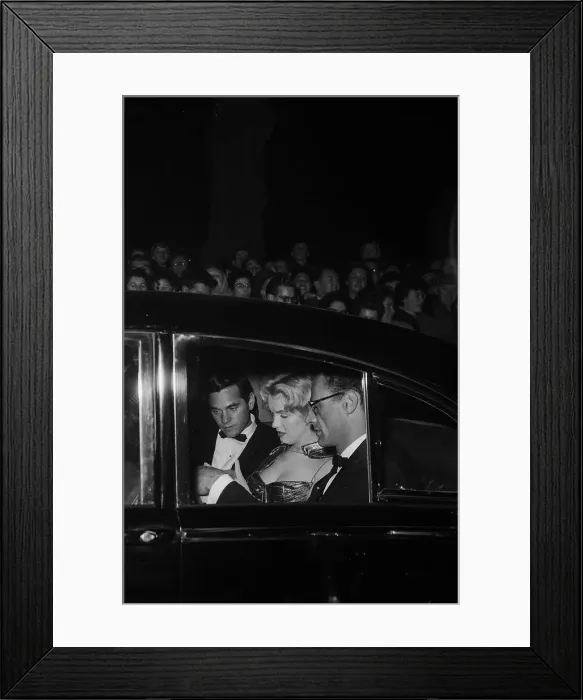 Framed Print : Marilyn Monroe arriving at the Royal Film Performance in a car with Arthur Miller