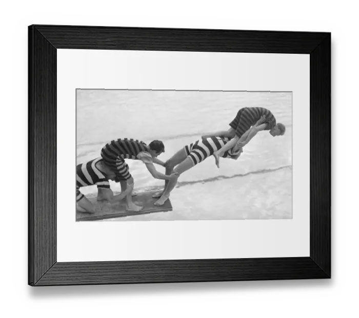 Framed Print : Acrobats from the Leon Marco Water Show clown about on a diving board Entertainment Framed Print : Acrobats from the Leon Marco Water Show clown about on a diving board Entertainment