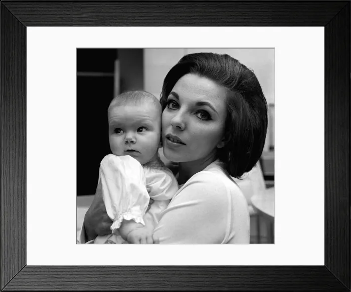 Framed Print : Joan Collins Actress February 1964 with four months old daughter Tara Newley Framed Print : Joan Collins Actress February 1964 with four months old daughter Tara Newley