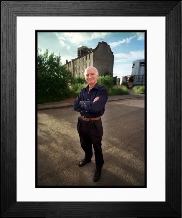 Framed Print : Dave Anderson actor June 1998 standing in the middle of road arms folded