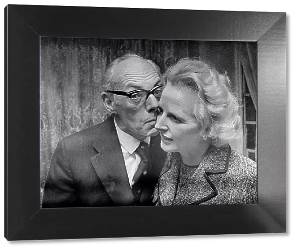 Margaret Thatcher with Denis Thatcher - February 1975 who kisses her on the cheek