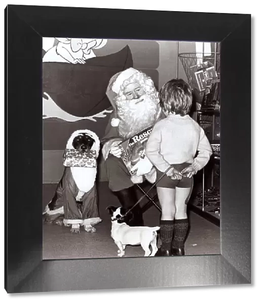 Father Christmas Santas Claus in his Grotto - December 1977 a little boy with his