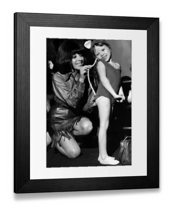 Framed Print : Mrs Anthony Newley (actress Joan Collins) this afternoon was acting as dresser to her 5