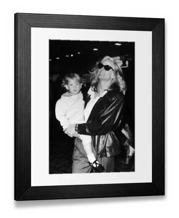 Framed Print : Farrah Fawcett Actress with her son Redmond leave for Los Angeles May 1987