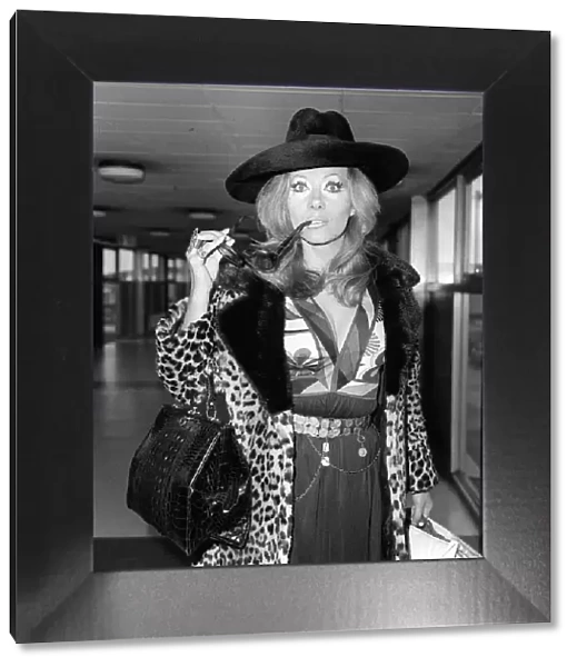 Ingrid Pitt arriving at Heathrow airport from Rome where she has had talks about her new