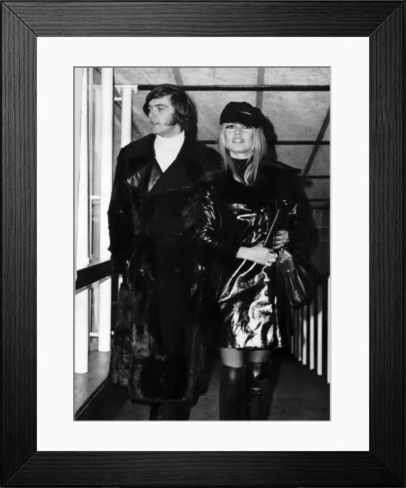 : Brigitte Bardot French actress with Patrick Gilles walking through the lounge at Heathrow : Brigitte Bardot French actress with Patrick Gilles walking through the lounge at Heathrow