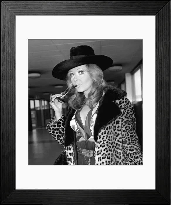 Framed Print : Ingrid Pitt arriving at Heathrow airport from Rome where she has had talks about her new Framed Print : Ingrid Pitt arriving at Heathrow airport from Rome where she has had talks about her new