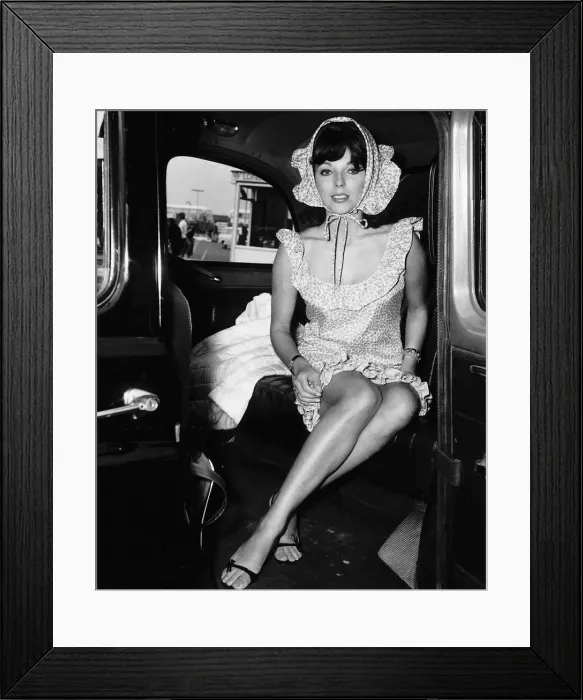 Framed Print : Joan Collins actress wearing a bonet