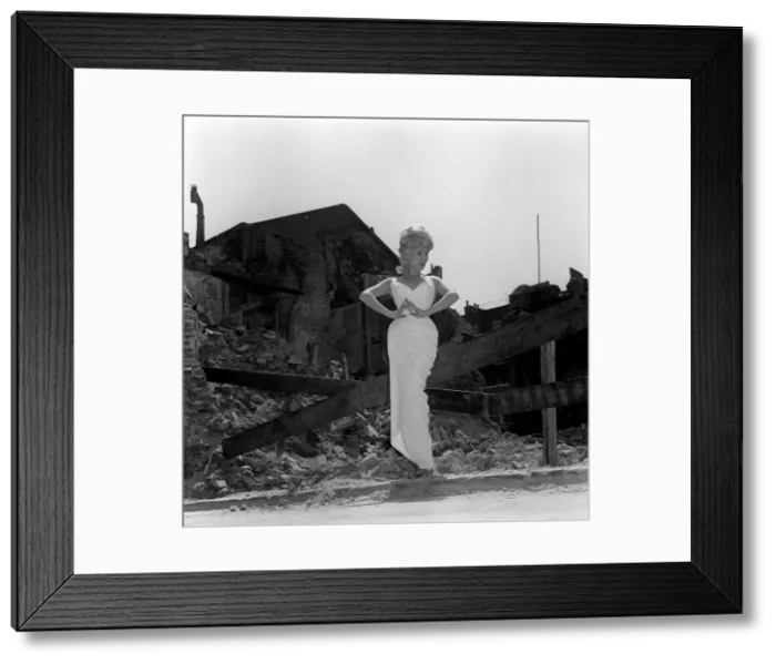 Framed Print : Actress and singer Jill Day June 1962 posing outside a demolished building