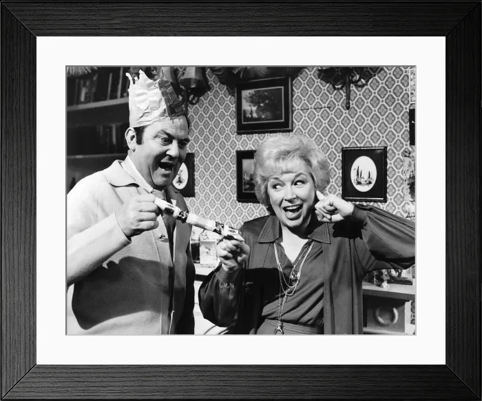 Framed Print : Terry & June Actor & Actress in their Christmas show pulling a cracker Framed Print : Terry & June Actor & Actress in their Christmas show pulling a cracker