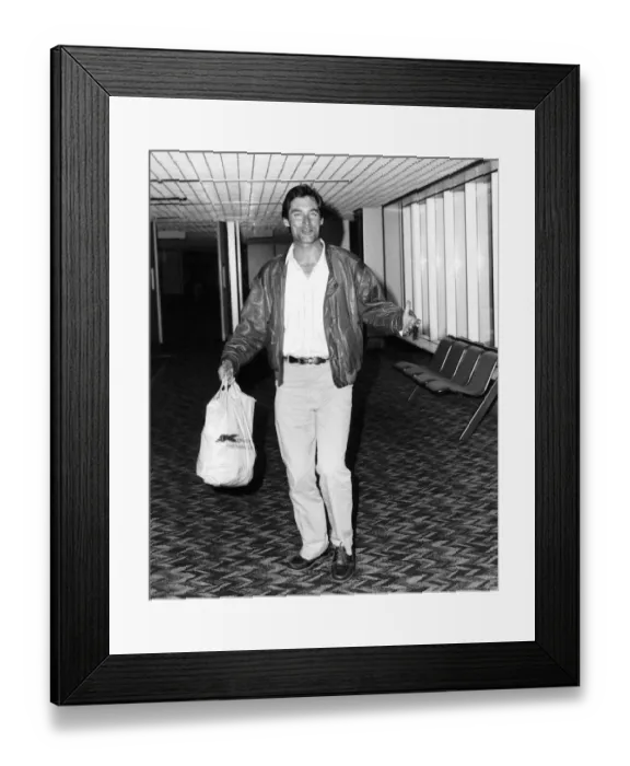 Framed Print : Timothy Dalton actor who stars in the film The Living Daylights arrives at Heathrow Framed Print : Timothy Dalton actor who stars in the film The Living Daylights arrives at Heathrow