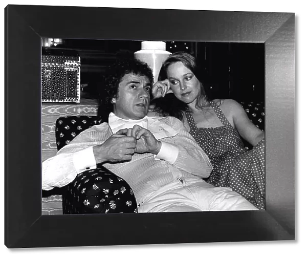 Jill Eikenberry sitting on a sofa with Dudley Moore actor and musician dbase