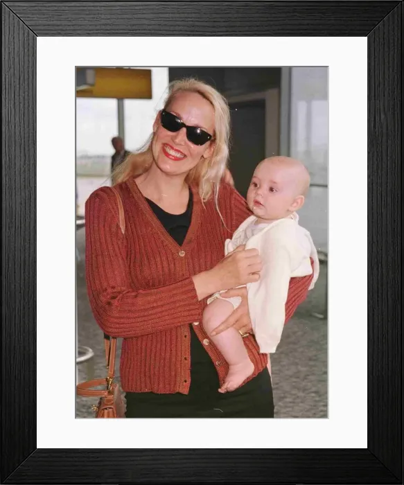 Framed Print : Jerry Hall model actress and new baby Gabriel June 1998 arrive at Heathrow from Nice Framed Print : Jerry Hall model actress and new baby Gabriel June 1998 arrive at Heathrow from Nice