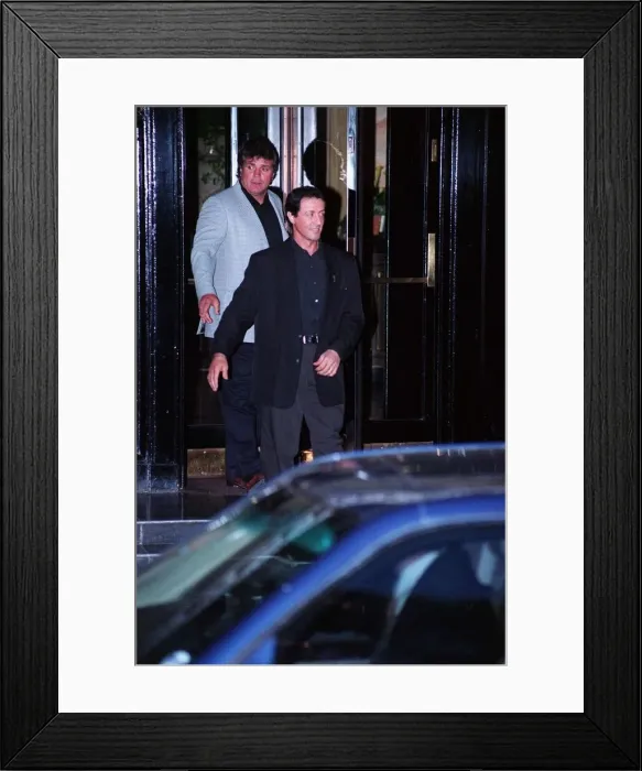 Framed Print : Sylvester Stallone Actor leaving hotel with minder Framed Print : Sylvester Stallone Actor leaving hotel with minder