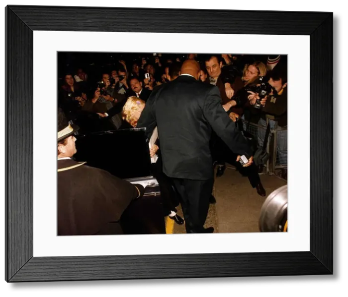 Framed Print : Madonna actress & singer getting out of a car with her bodyguard The Wall Framed Print : Madonna actress & singer getting out of a car with her bodyguard The Wall