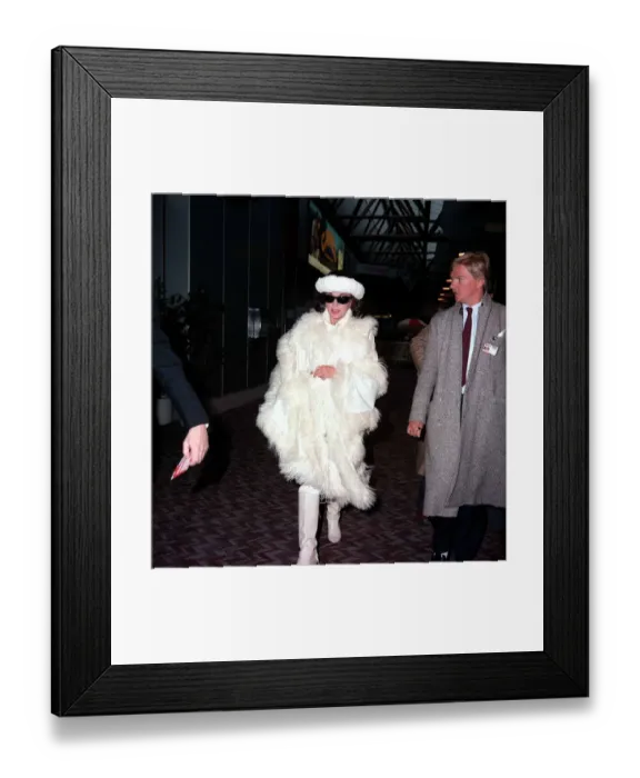 Framed Print : Actress Joan Collins arriving at Lodon Airport February 1987