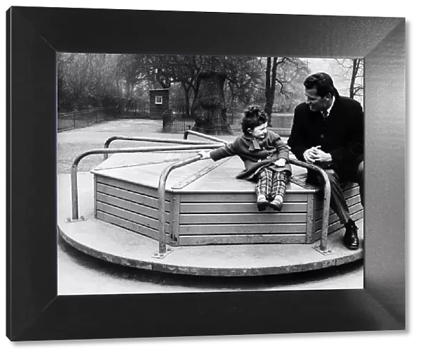 James Garner American actor on roundabout with child 1964