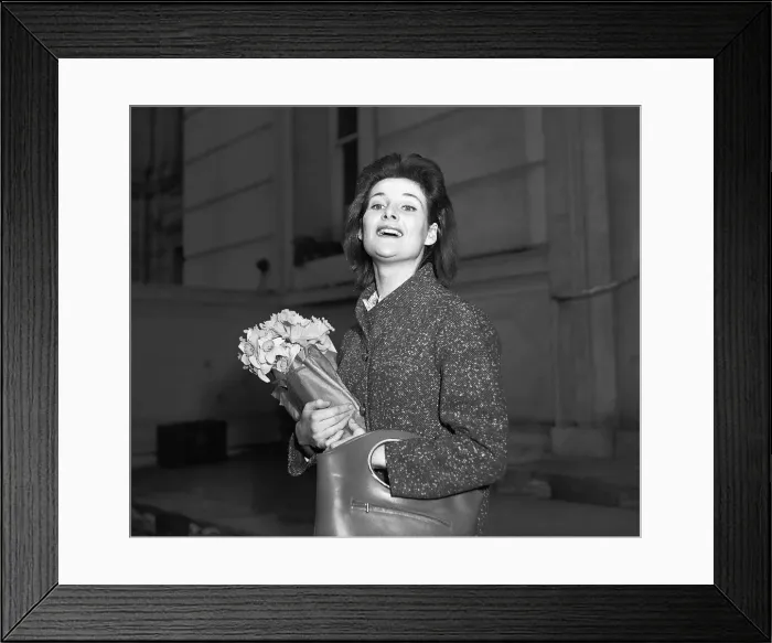 Framed Print : Actress Adrienne Corrie holding a bunch of flowers April 1956 Framed Print : Actress Adrienne Corrie holding a bunch of flowers April 1956