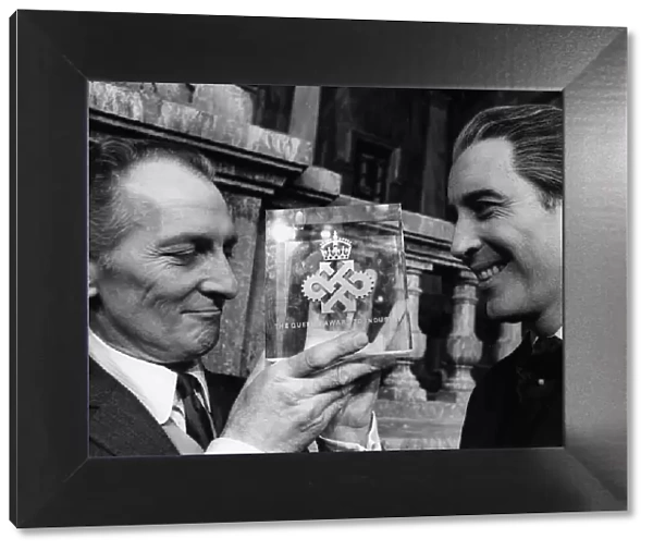 Peter Cushing actor (L) with Queens Award for Industry awarded to Hammer Films with