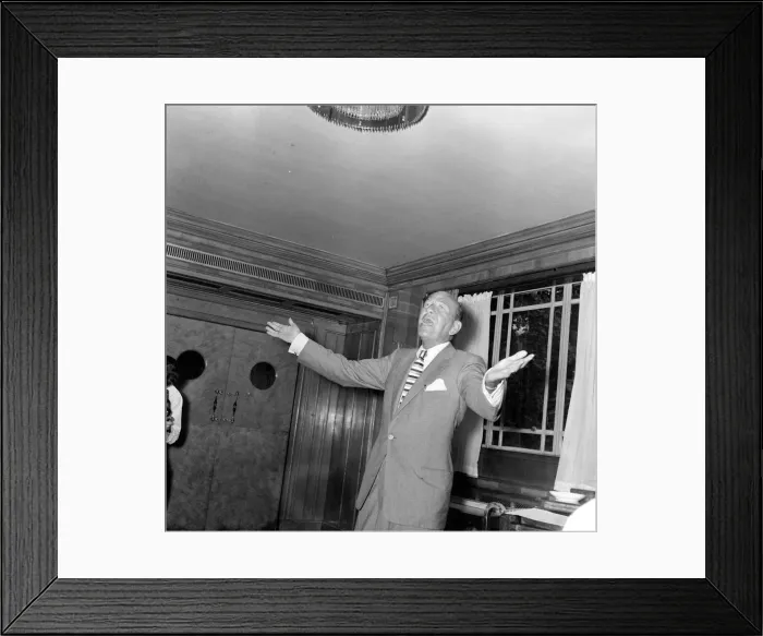 Framed Print : Actor and playwright Noel Coward performing at the Dorchester Hotel London Framed Print : Actor and playwright Noel Coward performing at the Dorchester Hotel London