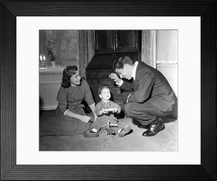 Framed Print : American Comedian and actor Jerry Lewis at home with his wife playing with their son