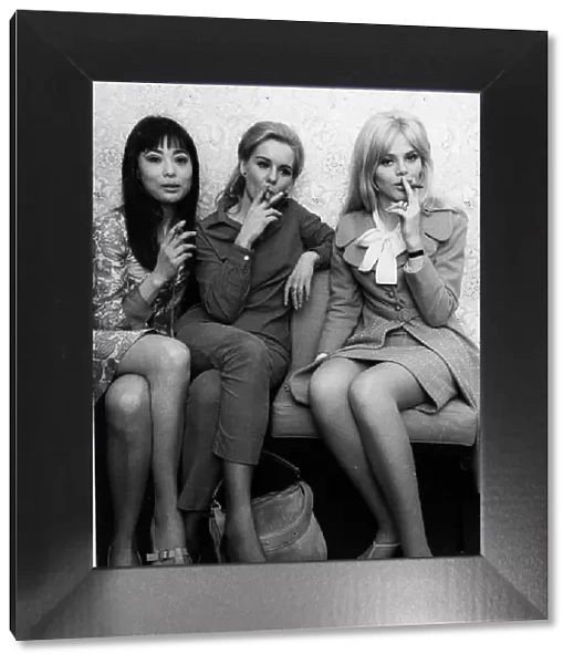 Britt Ekland (R) with Poulet Tu (L) and June Ritchie in 1966 smoking cigars
