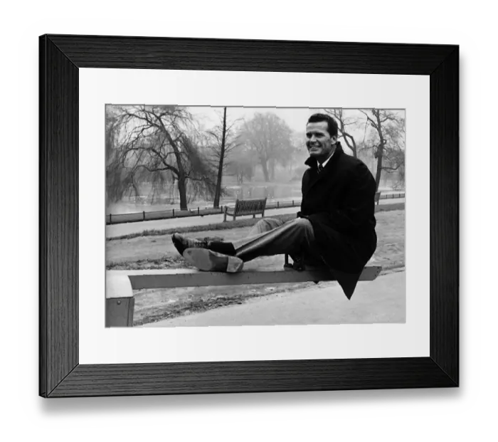 Framed Print : James Garner American actor sitting on see saw 1964