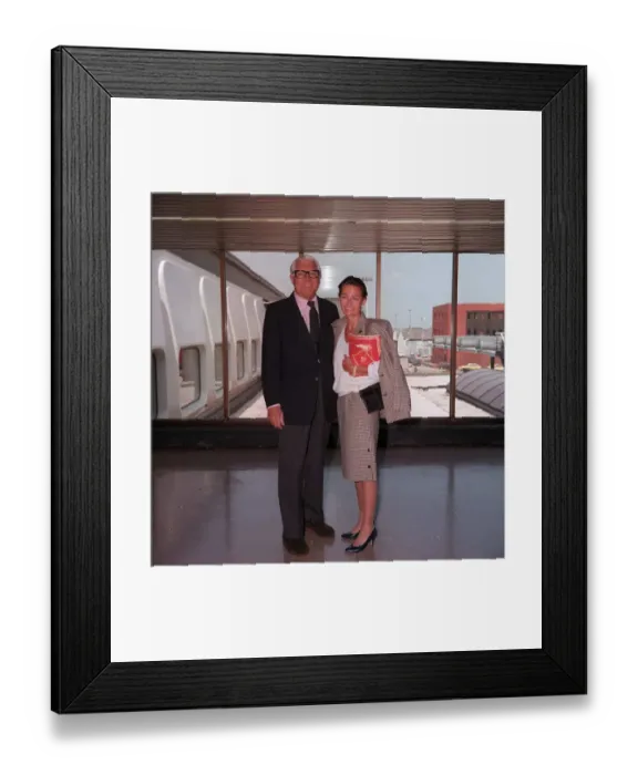 Framed Print : Actor Cary Grant arriving at London Airport with unidentifed woman June 1986 Framed Print : Actor Cary Grant arriving at London Airport with unidentifed woman June 1986