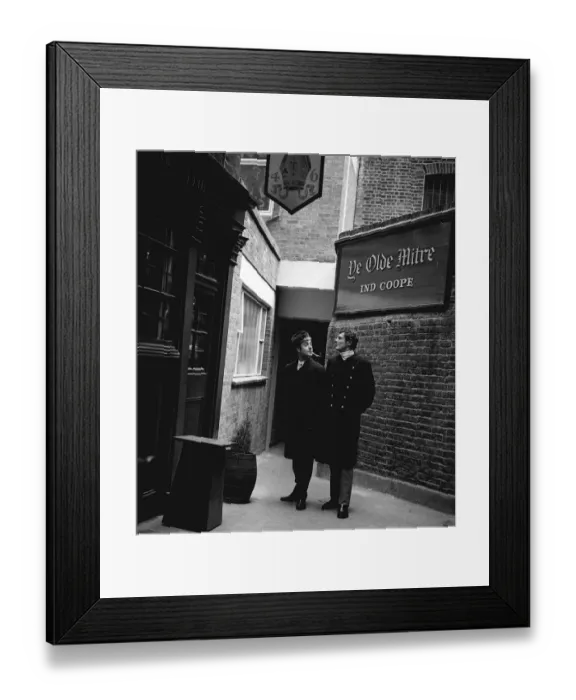 Framed Print : Actor Victor Spinetti models Dr Chivago style coat at a price of £12