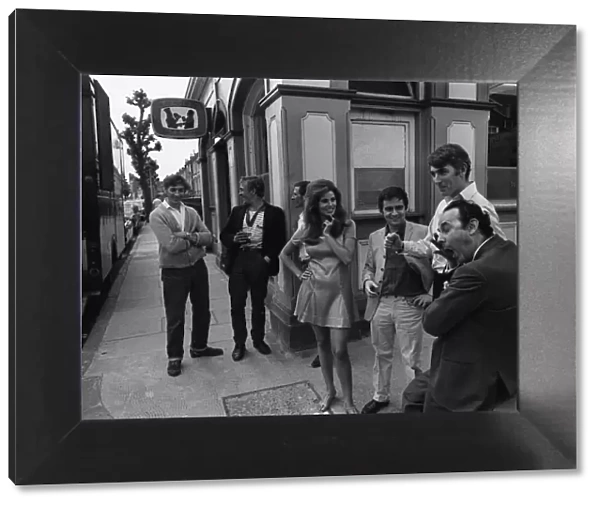 Film Bedazzled 1967 Raquel Welch Dudley Moore and Peter Cook standing outside pub
