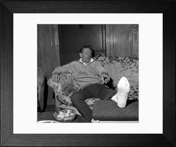 Framed Print : Danny Kaye at the Dorchester Hotel London nursing his badly burned foot He