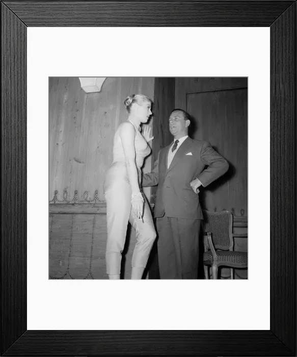 Framed Print : Actor Norman Wisdom with actress Anita Ekberg at the Savoy Hotel in London
