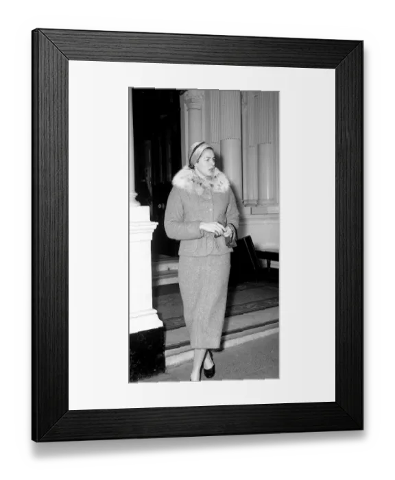 Framed Print : Ingrid Bergman window shopping in Bond Street London wearing fur trimmed tweed suit