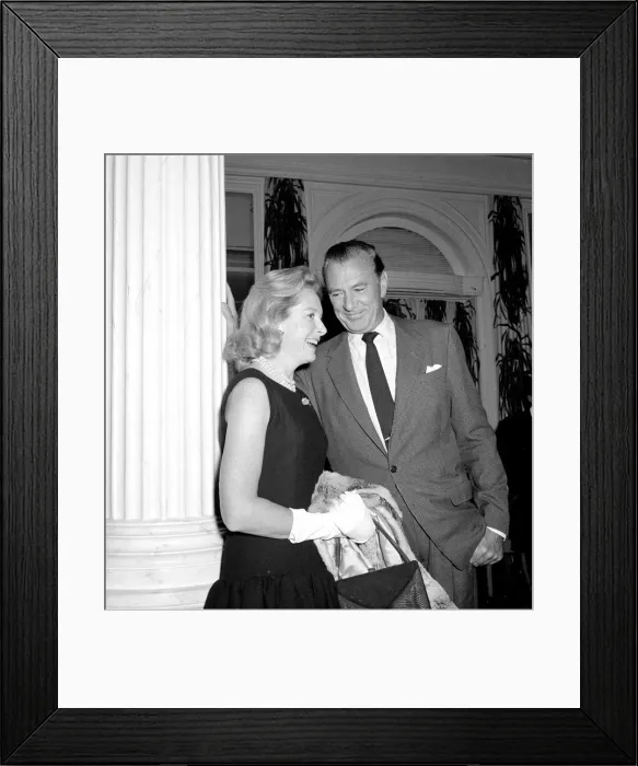 Framed Print : Gary Cooper at the Savoy hotel leaning against a column Framed Print : Gary Cooper at the Savoy hotel leaning against a column