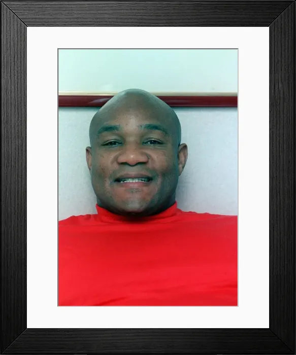 Framed Print : Fomer boxing champion George Foreman in a London hotel resting on bed September 1990 Framed Print : Fomer boxing champion George Foreman in a London hotel resting on bed September 1990