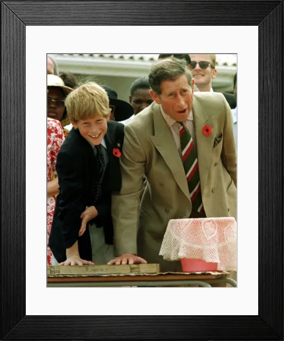 Framed Print : Prince Charles with his son Prince Harry leaving their hand prints in concrete on their Framed Print : Prince Charles with his son Prince Harry leaving their hand prints in concrete on their