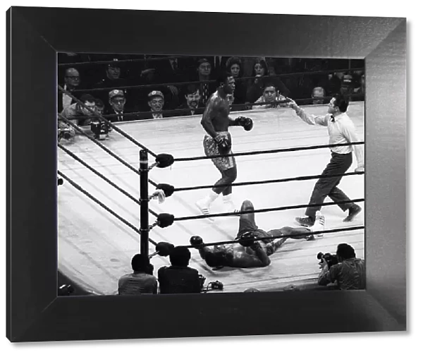 Action during the heavyweight World title fight between champion Joe Frazier