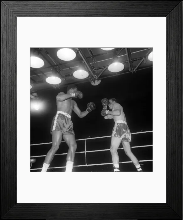 : Action during the non-title heavyweight fight between American Cassius Clay : Action during the non-title heavyweight fight between American Cassius Clay