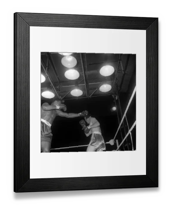 : Action during the non-title heavyweight fight between American Cassius Clay : Action during the non-title heavyweight fight between American Cassius Clay
