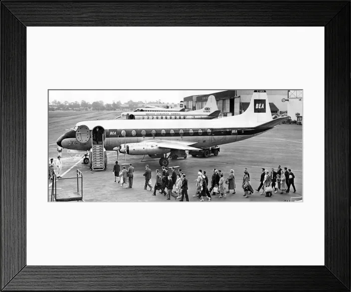 Framed Print : Aircraft line up at Elmdon airport as Midland holidaymakers queue to join a plane for Framed Print : Aircraft line up at Elmdon airport as Midland holidaymakers queue to join a plane for