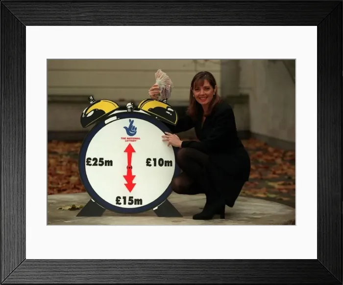  : Carol Vorderman TV Presenter November 97 With a lottery clock which shows an arrow
