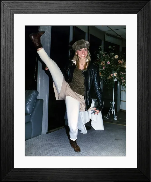 Framed Print : Michaela Strachan TV Presenter kicking her right leg up high