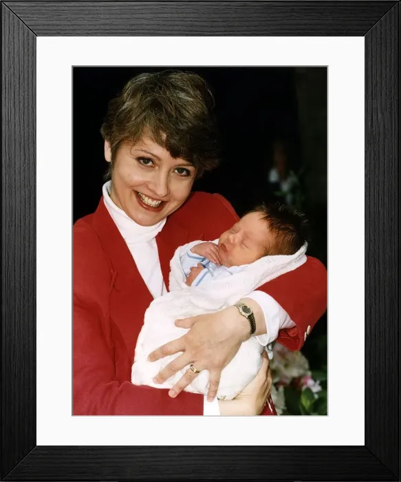 Framed Print : Anne Diamond TV Presenter holding baby