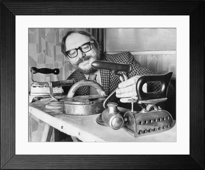 Framed Print : George Dickinson with his collection of flat irons, tells his pub customers that they can Framed Print : George Dickinson with his collection of flat irons, tells his pub customers that they can