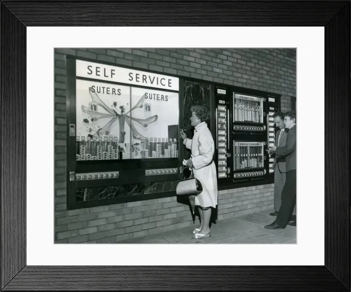 Framed Print : Sweets, food, cigarettes and even nylons can be bought from these automatic retailing