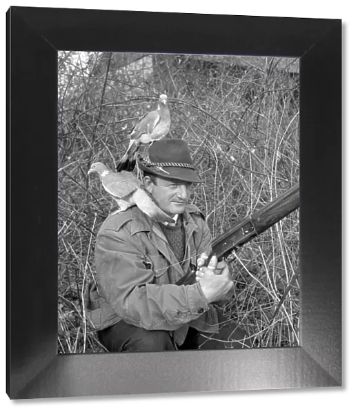 Hunter wearing pigeon decoy Circa 1963