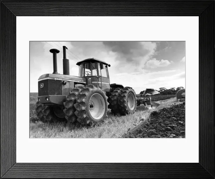 Framed Print : A John Deere 8440s tractor pulling a plough Framed Print : A John Deere 8440s tractor pulling a plough