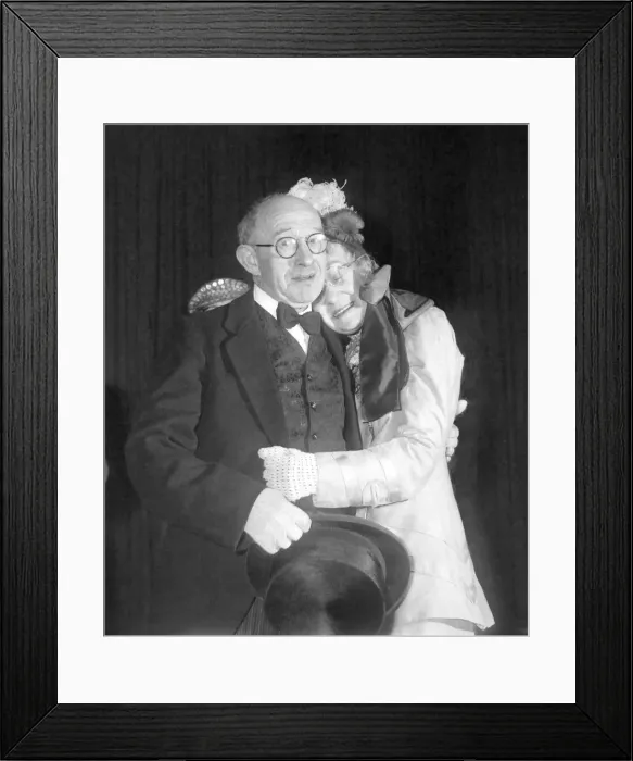 Framed Print : Old couple hug during a concert performance Framed Print : Old couple hug during a concert performance