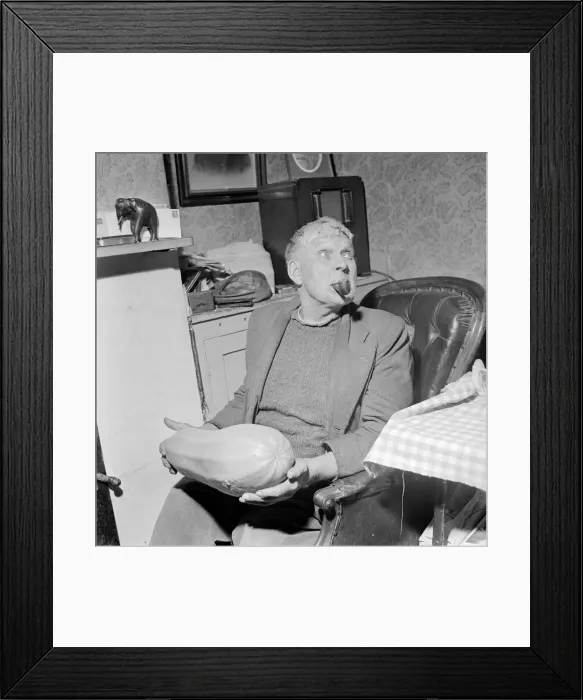 Framed Print : Archie Haffenden seen here enjoying his pipe and holding his prize marrow Circa