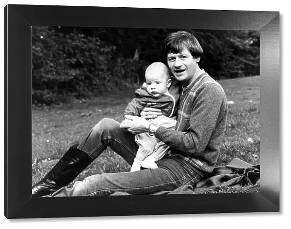 Alex Higgins former World Snooker Champion 1983 with his son at home